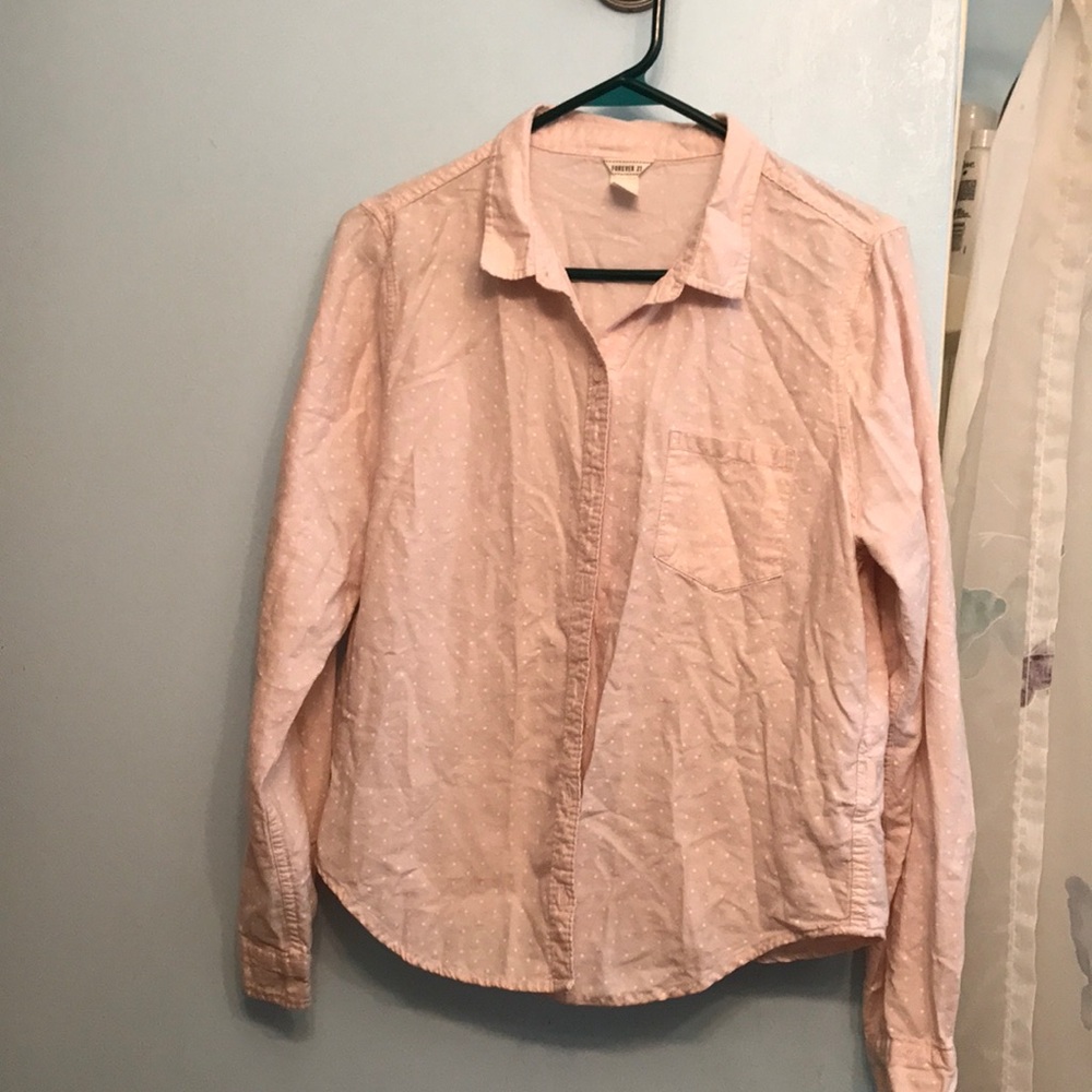 A light pink button up shirt